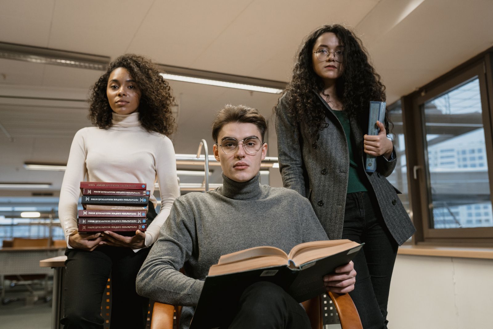 Students holding books while preparing for exams